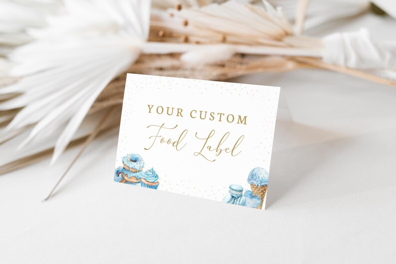 May include: A white card with gold text that reads "Your Custom Food Label". The card is decorated with blue and white watercolour illustrations of doughnuts, cupcakes, and ice cream.