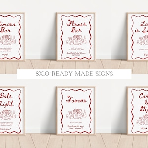 May include: Set of ten 8x10 inch printable signs for a bridal shower. The signs are white with red text and illustrations. The signs include: Mimosa Bar, Flower Bar, Love is Sweet, Date Night, Favors, Cards & Gifts.