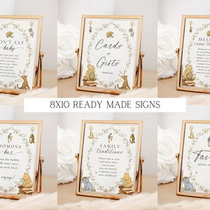 May include: Set of 8x10 inch printable signs featuring Winnie the Pooh and Piglet characters. The signs include titles like "Don't Say Baby", "Cards & Gifts", "Message from the Bump", "Mimosa Bar", "Family Traditions", and "Favors".