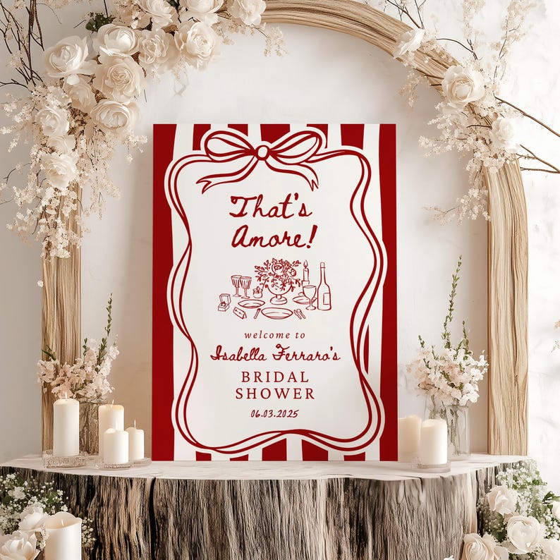 May include: Red and white striped bridal shower sign with the text "That's Amore!" and "Isabella Ferraro's Bridal Shower 06.03.2025".