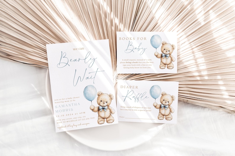 May include: Three baby shower cards with a teddy bear holding a blue balloon. The cards are for a diaper raffle, books for baby, and a baby shower invitation that says "We Can Bearly Wait".