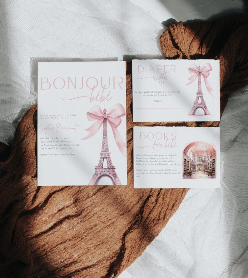 May include: A set of three baby shower invitations with a Parisian theme. The invitations are decorated with a pink bow and a watercolor illustration of the Eiffel Tower. The text on the invitations reads "Bonjour Bebe", "Diaper Raffle", and "Books for Bebe".