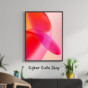 May include: Abstract art print with overlapping pink and red circles on a light peach background. The print is framed in black and hangs on a white wall above a black sofa.