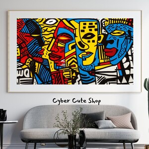 May include: Abstract art print featuring three colorful faces with geometric patterns in red, yellow, blue, and black. The print is framed and hanging on a white wall.