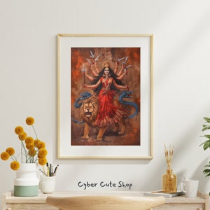 May include: A painting of a Hindu goddess with multiple arms, riding a lion. She is wearing a red dress and a crown. The background is a brown color.