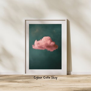 Puede incluir: Impresión artística enmarcada que presenta una nube rosa sobre un fondo verde azulado. La nube está centrada, con una textura suave y esponjosa. La impresión está en un marco blanco, con el texto "Cyber Cute Shop" en la parte inferior.