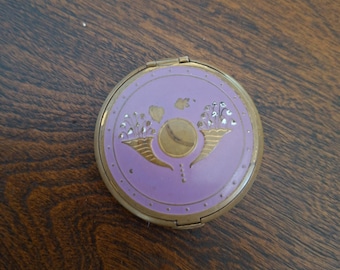 Portacipria vintage Richard Hudnut: motivo floreale in smalto viola (anni '30-'40)