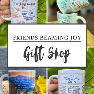 May include: Four white ceramic mugs with inspirational quotes and designs. The mugs feature a variety of colors and patterns, including a mountain scene, a floral design, and a heart. The mugs are all labeled with the words "My Faithful Women Mug" and "My Faithful Men Mug".