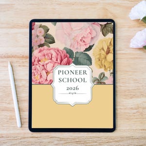 May include: A digital tablet with a floral design featuring pink and yellow flowers, green leaves, and the text "PIONEER SCHOOL 2026" on a cream-colored background. A white stylus rests on a wooden surface.