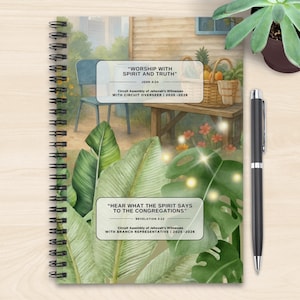 May include: A spiral-bound notebook with a watercolor illustration featuring tropical leaves and a serene outdoor scene. The notebook includes text that reads "Worship with Spirit and Truth" and "Hear What the Spirit Says to the Congregations."