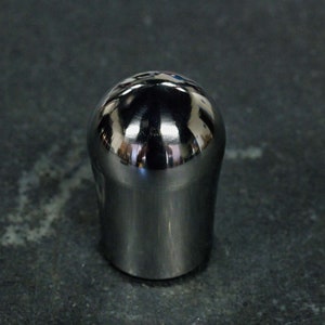 May include: A shiny, silver, round-top knob with a smooth, polished finish.