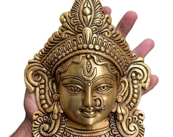 This exquisite Gauri face brass statue 19 cm captures the serene and divine expression of Goddess Gauri