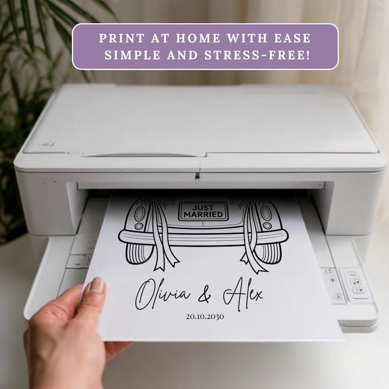 May include: A white printer printing a black and white wedding car design on paper. The design includes the words "Just Married" and the names "Olivia & Alex" with a date. Text at the top reads "PRINT AT HOME WITH EASE SIMPLE AND STRESS-FREE!"