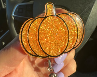 Carrete de insignia con purpurina de calabaza naranja de Halloween