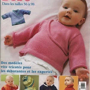 May include: A Diana Collection magazine cover featuring a baby wearing a pink long-sleeve wrap sweater. The cover displays text including "Bébé" and "Dans les tailles 56 à 98," along with smaller photos of babies in various knitted garments.
