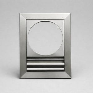 May include: A rectangular, brushed metal wall fixture with a circular aperture and horizontal slats. The fixture has a modern, minimalist design and is set against a plain background.