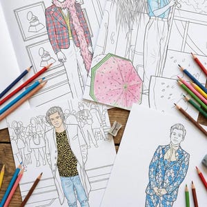 May include: Four coloring book pages with illustrations of a celebrity in various outfits. The pages are surrounded by colored pencils, a pencil sharpener, and an eraser. One page has a watermelon umbrella.