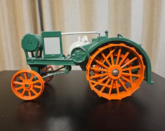 VIntage ERTL Model 559-8701. Overtime Tractor, A Worker, 1:16 Diecast Farm Tractor plus a Smaller Die Cast Tractor by Unknown Maker