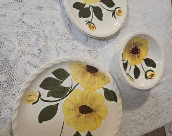 Vintage Southern Potteries, Inc. Blue Ridge Hand Painted Underglaze Offwhite Plates and Bowls with Yellow Flowers and Green Leaves.