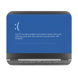 May include: A blue screen of death on a laptop computer with the message "Your PC ran into a problem and needs to restart. We're just collecting some error info, and then you can restart. (0% complete)"