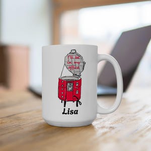 May include: White ceramic mug featuring a red and black illustration of a food dehydrator with the text "I'll be in my office" and the name "Lisa" printed on the base.