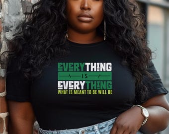 May include: A black t-shirt with a green and white graphic print that reads "Everything is Everything. What is meant to be will be."