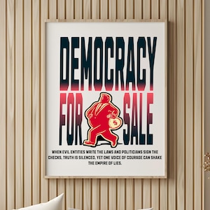 Puede incluir: Un póster enmarcado con las palabras "DEMOCRACY FOR SALE" en letras rojas y negras en negrita. Una figura de dibujos animados roja que sostiene una bolsa de dinero está en el centro. La parte inferior del póster tiene el texto "WHEN EVIL ENTITIES WRITE THE LAWS..."