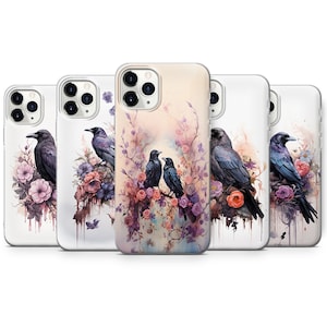 May include: Set of five phone cases featuring a watercolour design of crows perched on branches with pink and purple flowers. The cases are white with a clear back and a black camera bump.