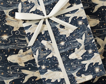 May include: A navy blue gift wrap with a white ribbon. The wrapping paper features a repeating pattern of white koi fish swimming in a dark blue sky with gold stars and white clouds.