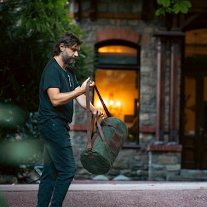 Man carrying a shoulder bag for sports