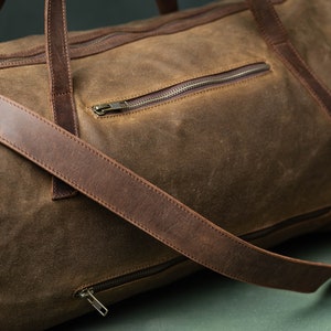 Close up view of a weekender with 2 side pockets