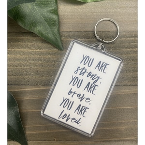 You are strong, you are brave, you are loved keychain with inspirational saying/positive quote/affirmations/daily reminder. Cute gift