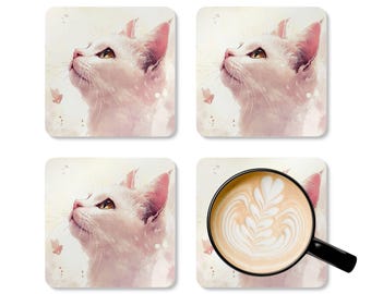 May include: Set of four square coasters. Three coasters feature a watercolor illustration of a white cat with pink ears and a focused gaze. The fourth coaster shows a coffee cup with latte art, viewed through a magnifying glass.