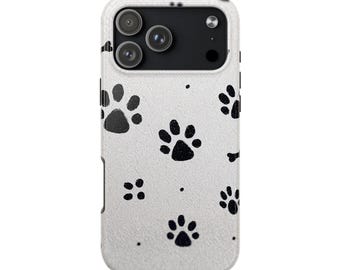 May include: A white smartphone case featuring a repeating pattern of black animal paw prints and small dots. The case has a rectangular cutout at the top left for a triple-lens camera system and a flash, with a textured surface finish.