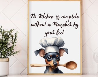 Könnte beinhalten: Ein gerahmter Druck mit einer Aquarellillustration eines Zwergpinschers, der eine Kochmütze trägt und einen Holzlöffel hält. Der Text lautet: „Keine Küche ist komplett ohne einen Pinscher zu Ihren Füßen.“