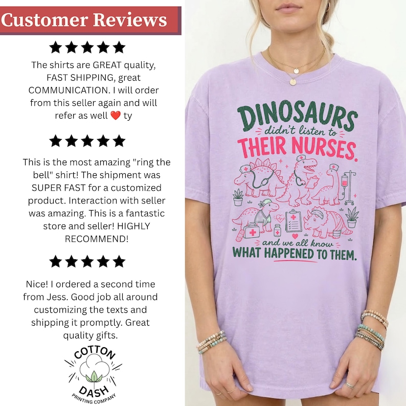 May include: A light purple short-sleeve t-shirt featuring a graphic print of cartoon dinosaurs dressed as medical professionals. The text reads: DINOSAURS didn't listen to THEIR NURSES. and we all know WHAT HAPPENED TO THEM. The design includes medical icons.