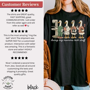 May include: Black t-shirt with a cartoon graphic of ducks in medical attire, including a mammogram machine. The text "doing my mammo tech stuff" is below the graphic. Customer reviews are on the left.