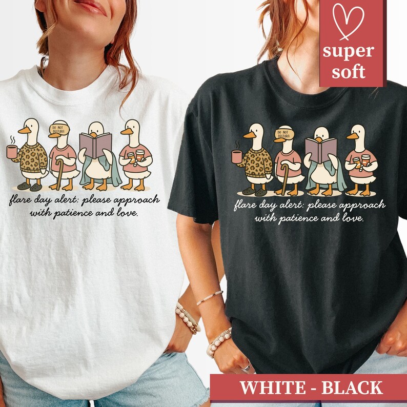 May include: White and black t-shirts featuring a whimsical illustration of ducks. Each duck is depicted with unique accessories, such as a coffee cup, leopard print sweater, and a book. The text "flare day alert: please approach with patience and love" is printed below the ducks.