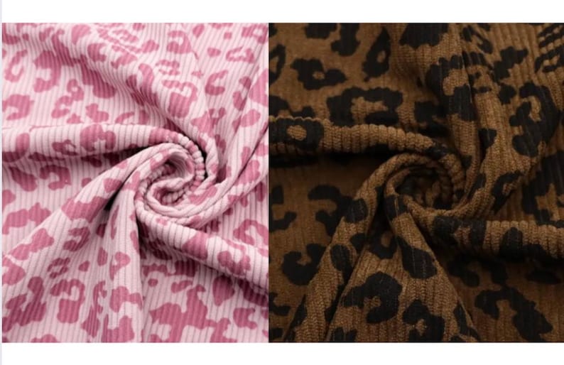May include: Two swatches of fabric, one pink and one brown, both with a leopard print pattern. The pink fabric has a light pink background with darker pink spots. The brown fabric has a brown background with black spots. Both fabrics are ribbed.