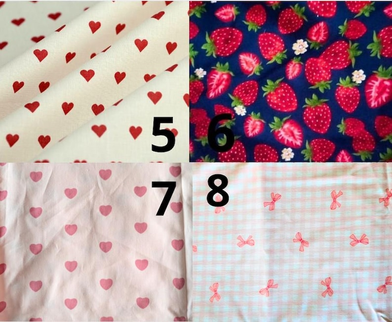 May include: Fabric swatches with various patterns. One swatch features red hearts on a cream background. Another displays strawberries and white flowers on a navy blue background. Other swatches have pink hearts and bows.