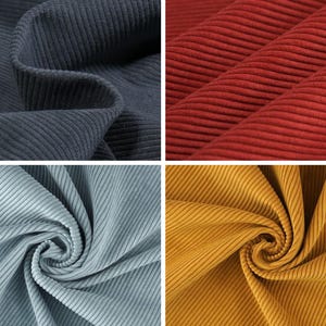 May include: Close-up of four swatches of corduroy fabric in different colors. The colors include a deep navy blue, a vibrant red, a light blue-green, and a golden yellow. The fabric has a ribbed texture.