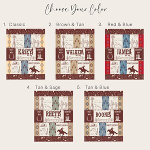 May include: Five different colour variations of a personalised baby blanket with a western theme. The blanket features a cowboy boot, a cactus, a horseshoe, a guitar, and a windmill. The blanket is available in classic, brown and tan, red and blue, tan and sage, and tan and blue.