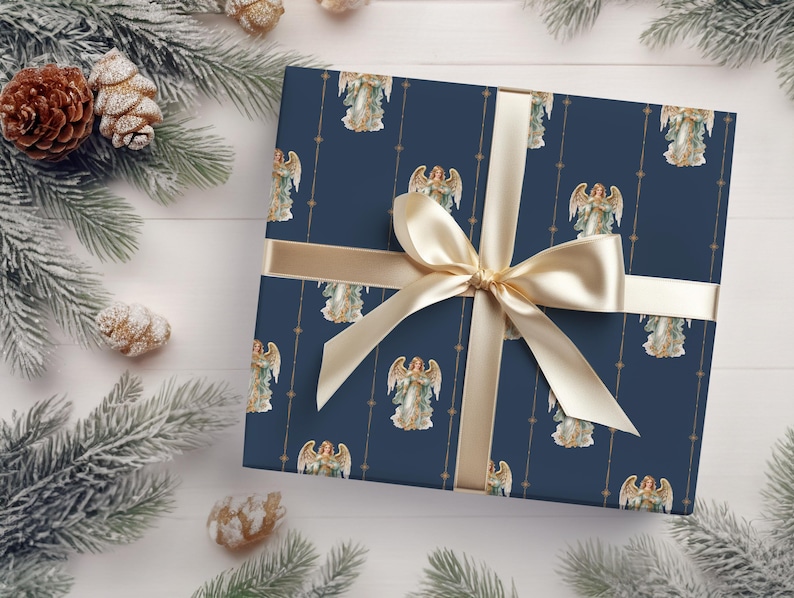 May include: A navy blue gift wrap with a gold ribbon and a repeating pattern of angels with gold halos and wings. The angels are holding a star in their hands.