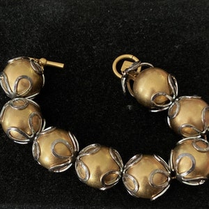 Vintage Ann Kline Gold ball bracelet with silver tone accents.