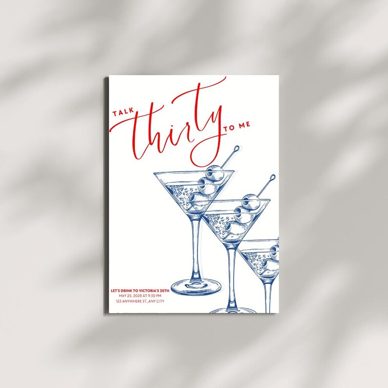 May include: White invitation card with red script text that reads "Talk Thirty to Me." Below, three martini glasses with olives are illustrated in blue. The card includes event details: "Let's Drink to Victoria's 30th" and the date and time.