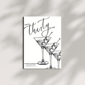 May include: Black and white invitation card with the text "Talk Thirty to Me". The card features three martini glasses with olives. Below the glasses is the text "Let's Drink to Victoria's 30th, May 25, 2028 at 9:30 PM, 123 Anywhere St, Any City."