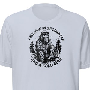 I believe in Sasquatch and a cold beer - Unisex organic cotton t-shirt - Funny Bigfoot Shirt - Cryptozoology Cryptid Loch Ness Monster