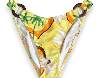 Slip bikini tropicale giallo vintage con guanto da bodystock