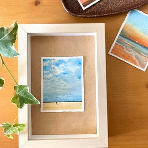 original mini watercolor painting about a lonely man on the beach