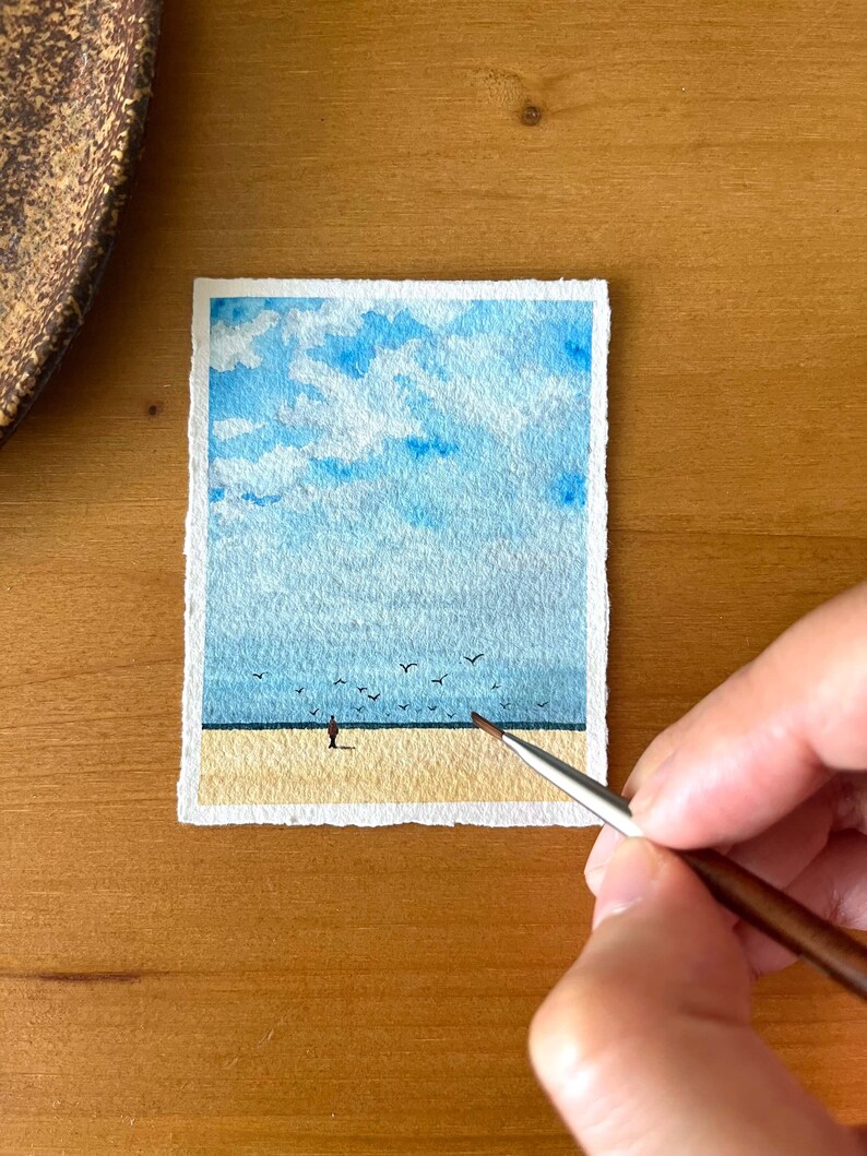 original mini watercolor painting about a lonely man on the beach